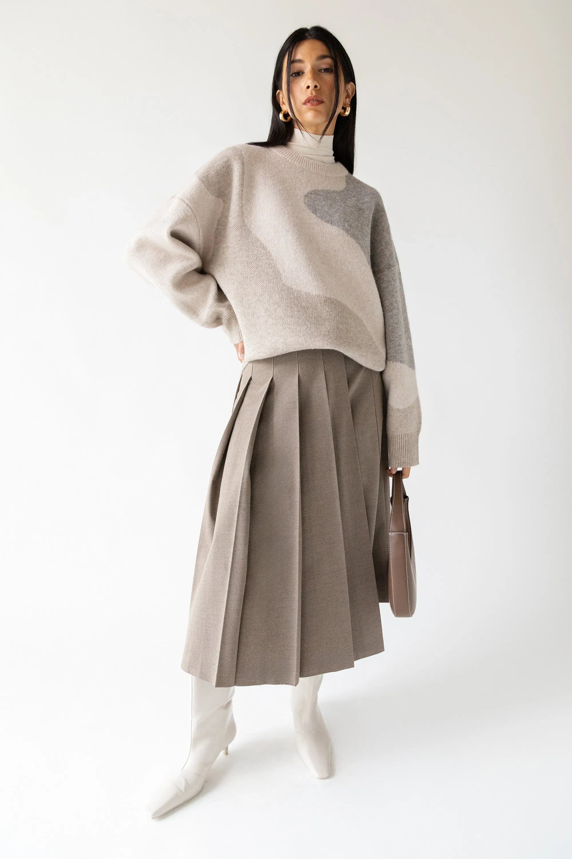 MIDI PLEATED ASYMMETRICAL SKIRT